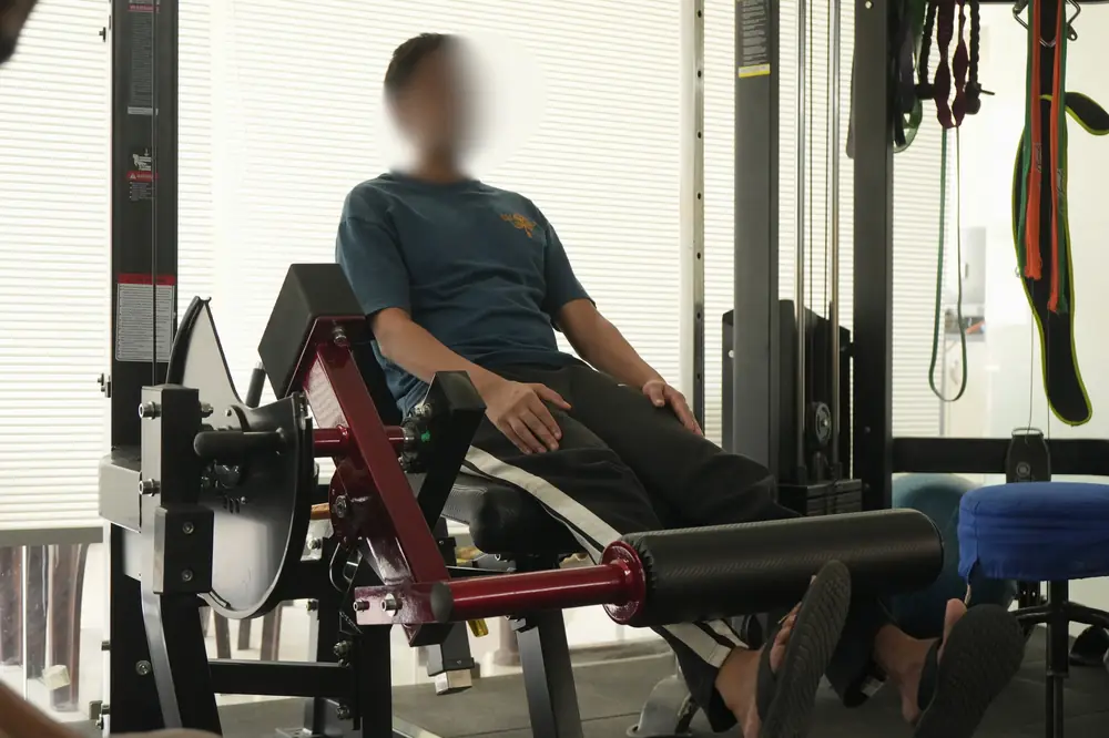 Leg press machine training at Affinity Rehab